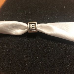 Sterling silver “E” Pandora charm